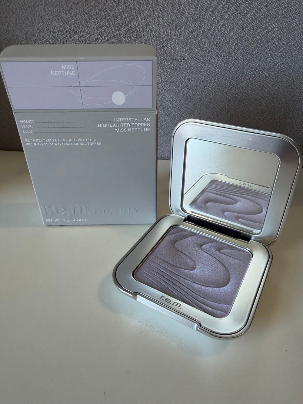 r.e.m. beauty highlighter in miss neptune